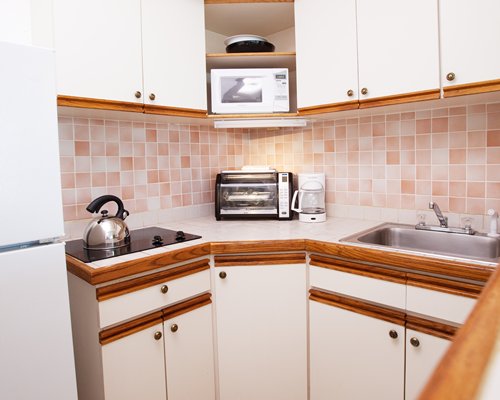 A well equipped kitchen with microwave.