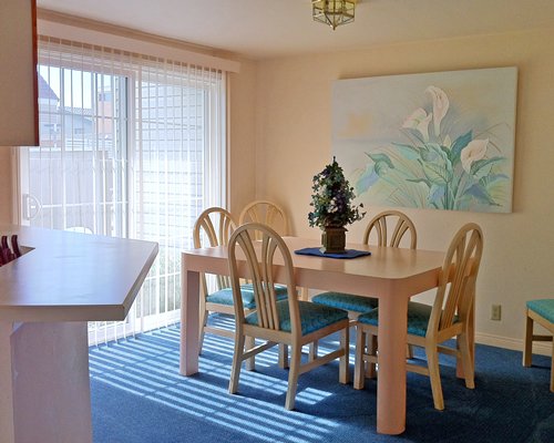 A well furnished dining room with an outside view.