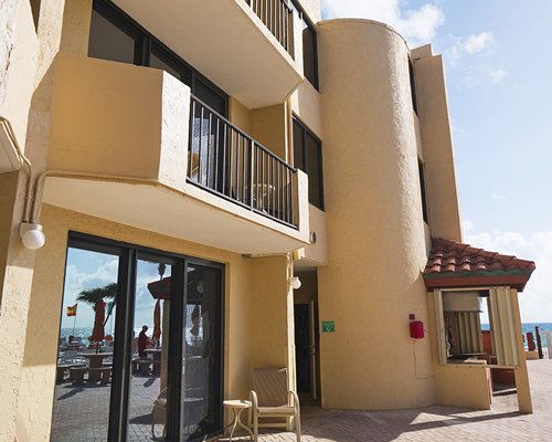 Exterior view of the Costa del Sol Resort with patio furniture.