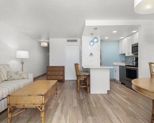 A well furnished living room with a breakfast bar.