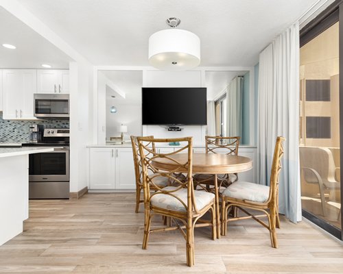 An open plan kitchen with a breakfast bar.