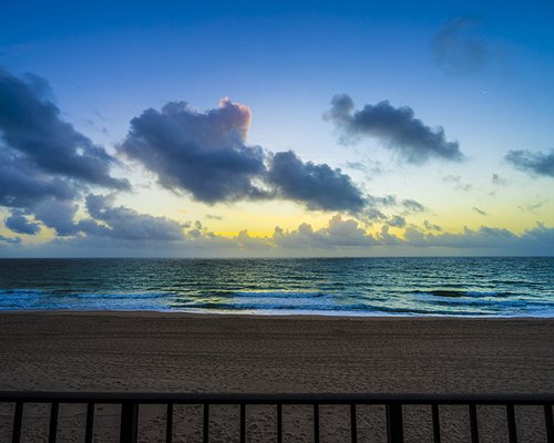 View of the beach and ocean at dusk.