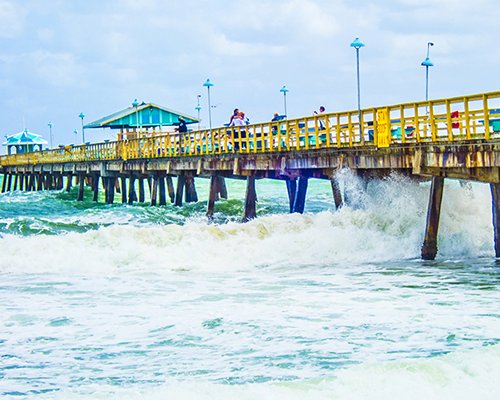 A wooden pier on the ocean.