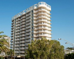 STREET VIEW OF THE BEACHCOMBER INTERNATIONAL RESORT WITH PARKING AREA.