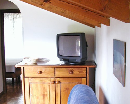 A well furnished living room with a television.