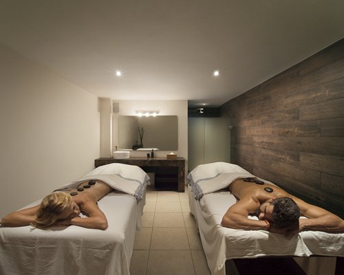 A couple enjoying massage at the spa.