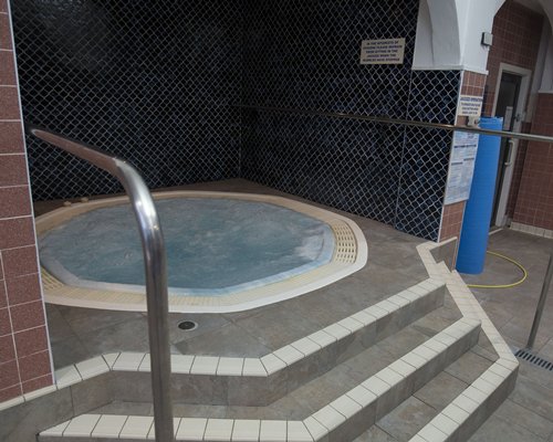 An outdoor octagonal hot tub.