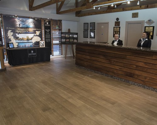 Reception area with a counter at Macdonald Spey Valley Resort.