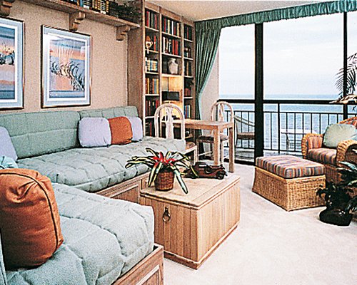 A well furnished living room with a balcony.