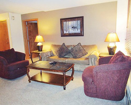 A well furnished living room with lampshades.