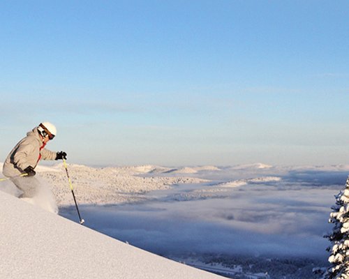 A man skiing in deep powder.