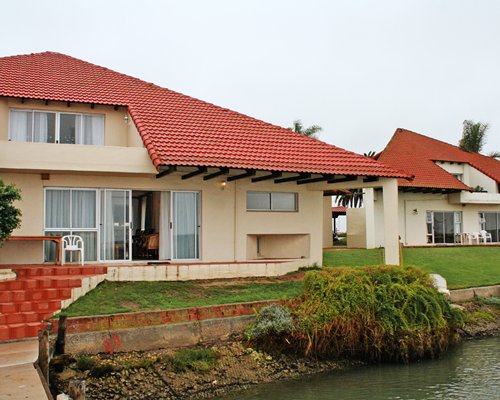 Exterior view of the units at Port Owen Marina alongside waterfront.