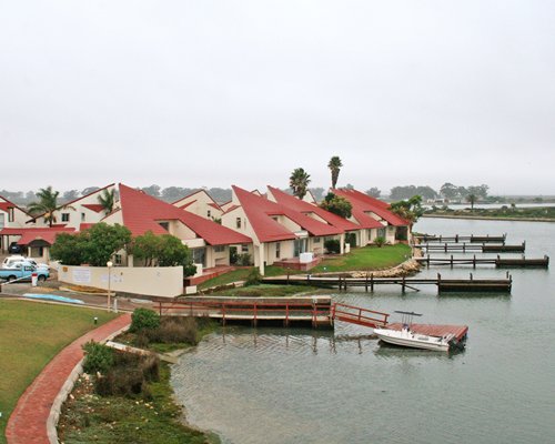 A pathway leading to the resort units alongside the waterfront.