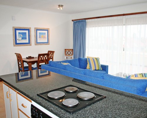 An open plan living dining and kitchen area.