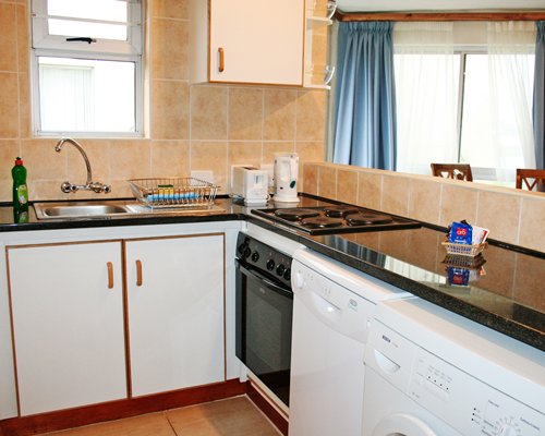 A well equipped kitchen with a stove.
