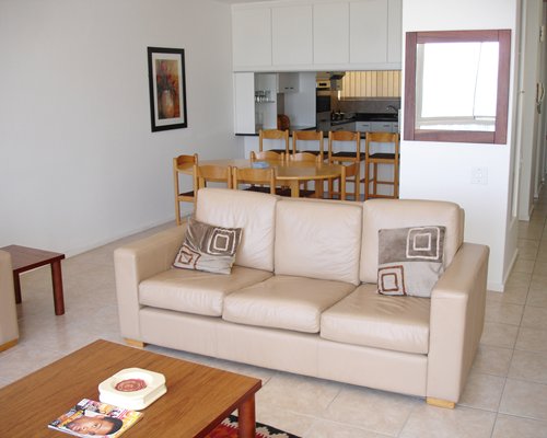 A well furnished living room and dining area.