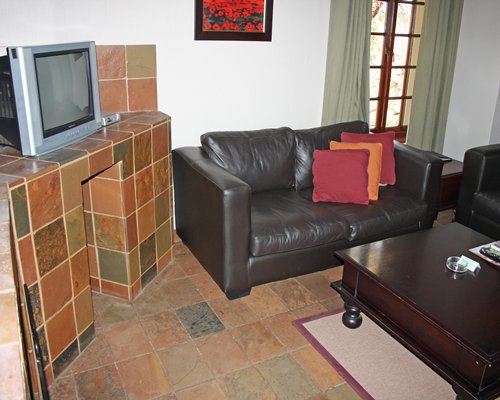 A well furnished living room with a television.