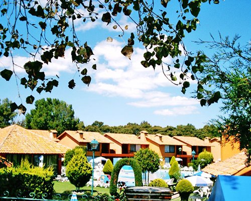 An exterior resort units alongside a swimming pool.