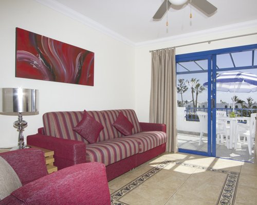 A well furnished living room with a balcony.