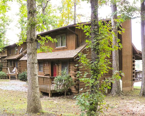 Exterior view of a unit at a wooded area.