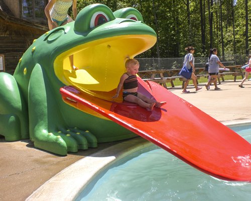 Kiddie pool with kids playscape.