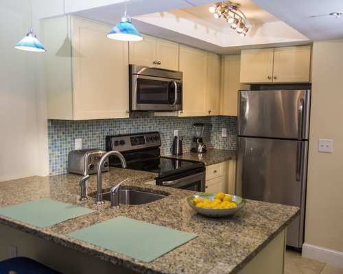 A well furnished kitchen with a breakfast bar.