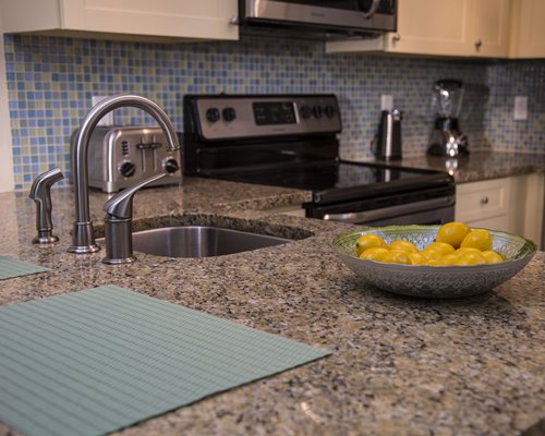 A well furnished kitchen with a view of a food item.