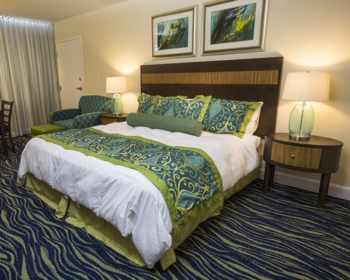 A well furnished bedroom with a king bed.