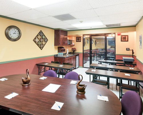 A well furnished indoor dining area with multiple dining tables.