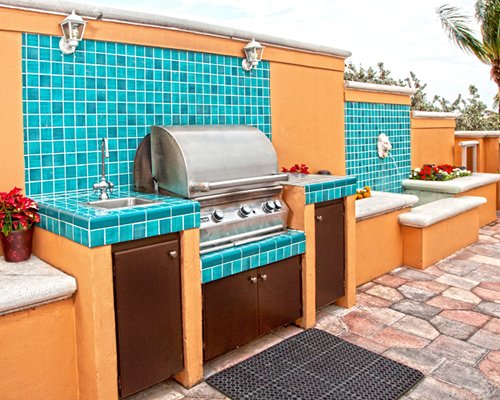 Outdoor picnic area with barbecue grill.