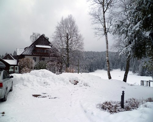 Exterior view of the Erlenbruck covered in snow.
