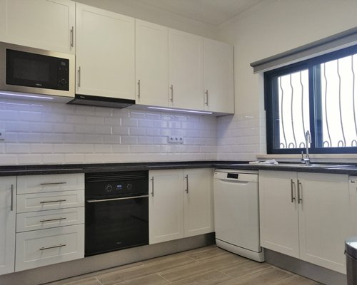An open plan kitchen with outside view.