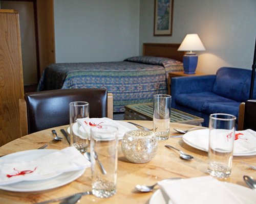A well furnished dining area alongside the bedroom.