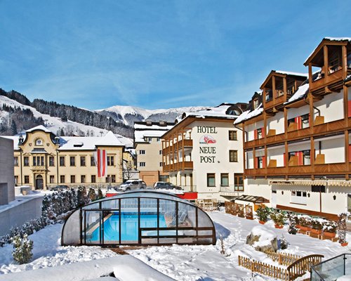 An exterior view of the resort with swimming pool during winter.