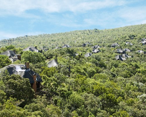 An exterior view of Mabalingwe Nature Reserve surrounded by wooded area.