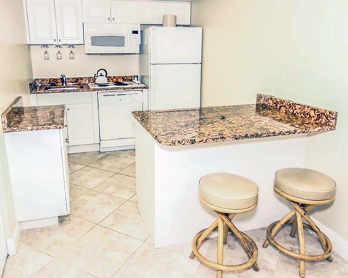 A well equipped kitchen with breakfast bar.