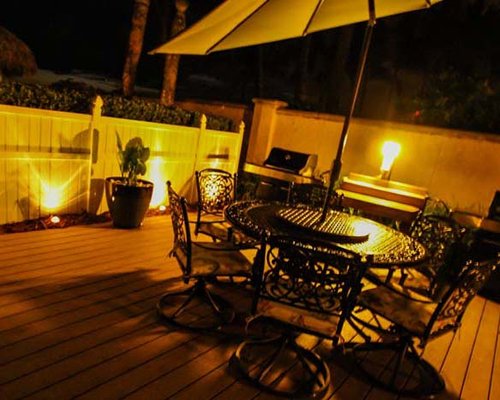 An outdoor dining area with a barbeque grill.