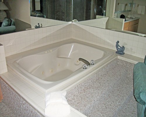 A bathroom with shower and bathtub.