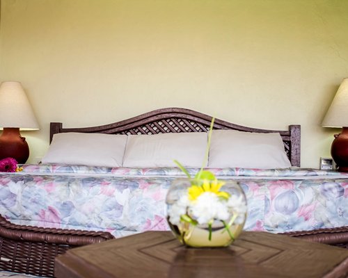 A well furnished bedroom with a king bed.