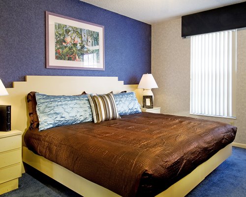 A well furnished bedroom with a king bed.