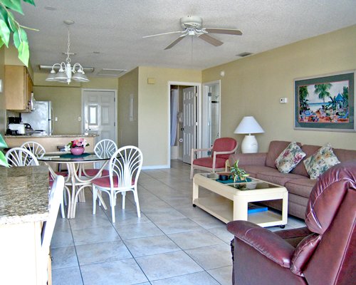 An open plan living and dining area alongside kitchen.
