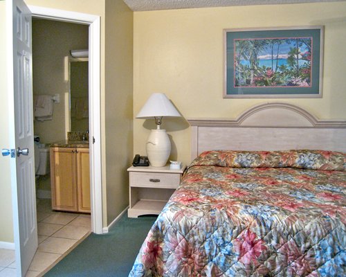 A well furnished bedroom with a king bed.