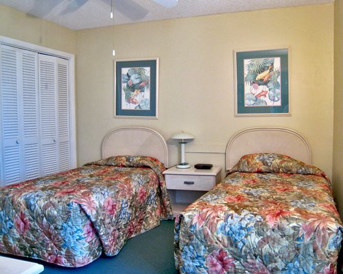 A well furnished bedroom with two beds.