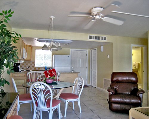 An open plan dining and kitchen area with a pull out sofa.