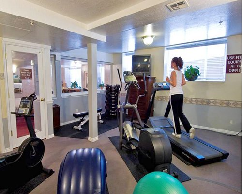 A woman exercising in an indoor fitness center.
