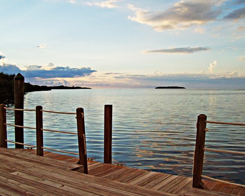 A view of the ocean from a wooden deck.