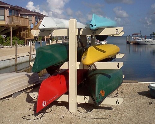 Set of kayaking boats alongside the ocean.
