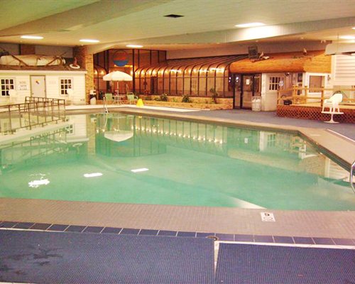 Indoor swimming pool with sunshades.