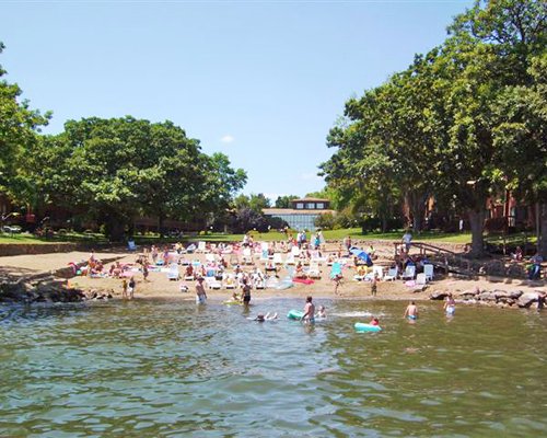Group people playing in the water park at the Sunrise Cove at Village West resort.