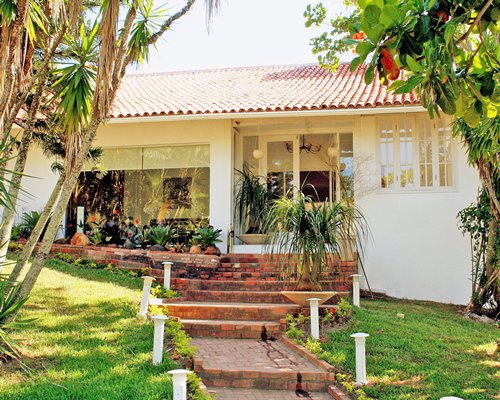 A paved pathway leading to the resort unit.